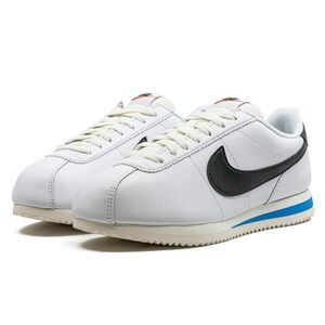 Nike White Sneakers with Black Swoosh and Blue Accent - Size W 8.5